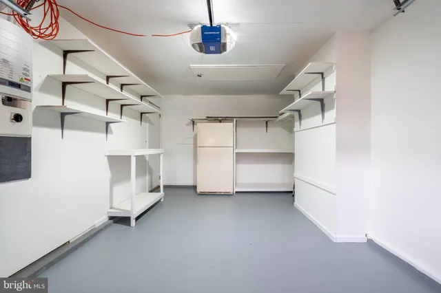 a view of a storage & utility room with racks on the wall