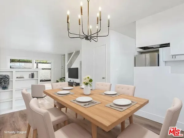 a view of a dining room that has a table and chairs