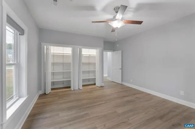 a view of kitchen with cabinets and wooden floor