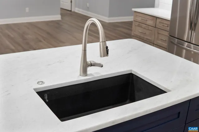 a stove top oven sitting inside of a kitchen