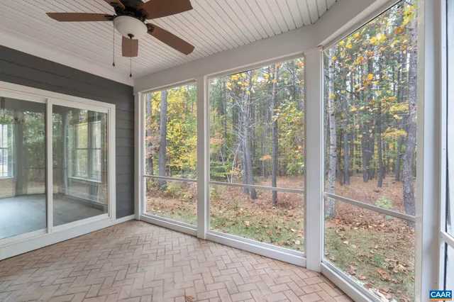 a view of a backyard with sitting area