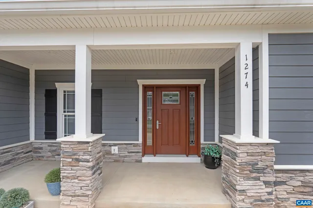 a view of a chairs and table in backyard