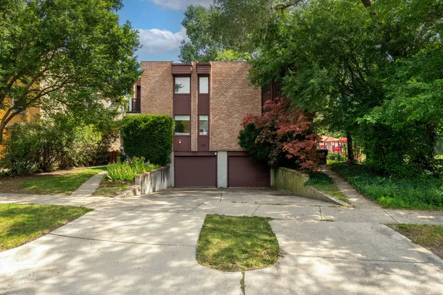 a view of house with yard and outdoor seating
