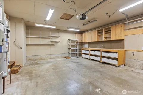 a view of an empty room with a garage