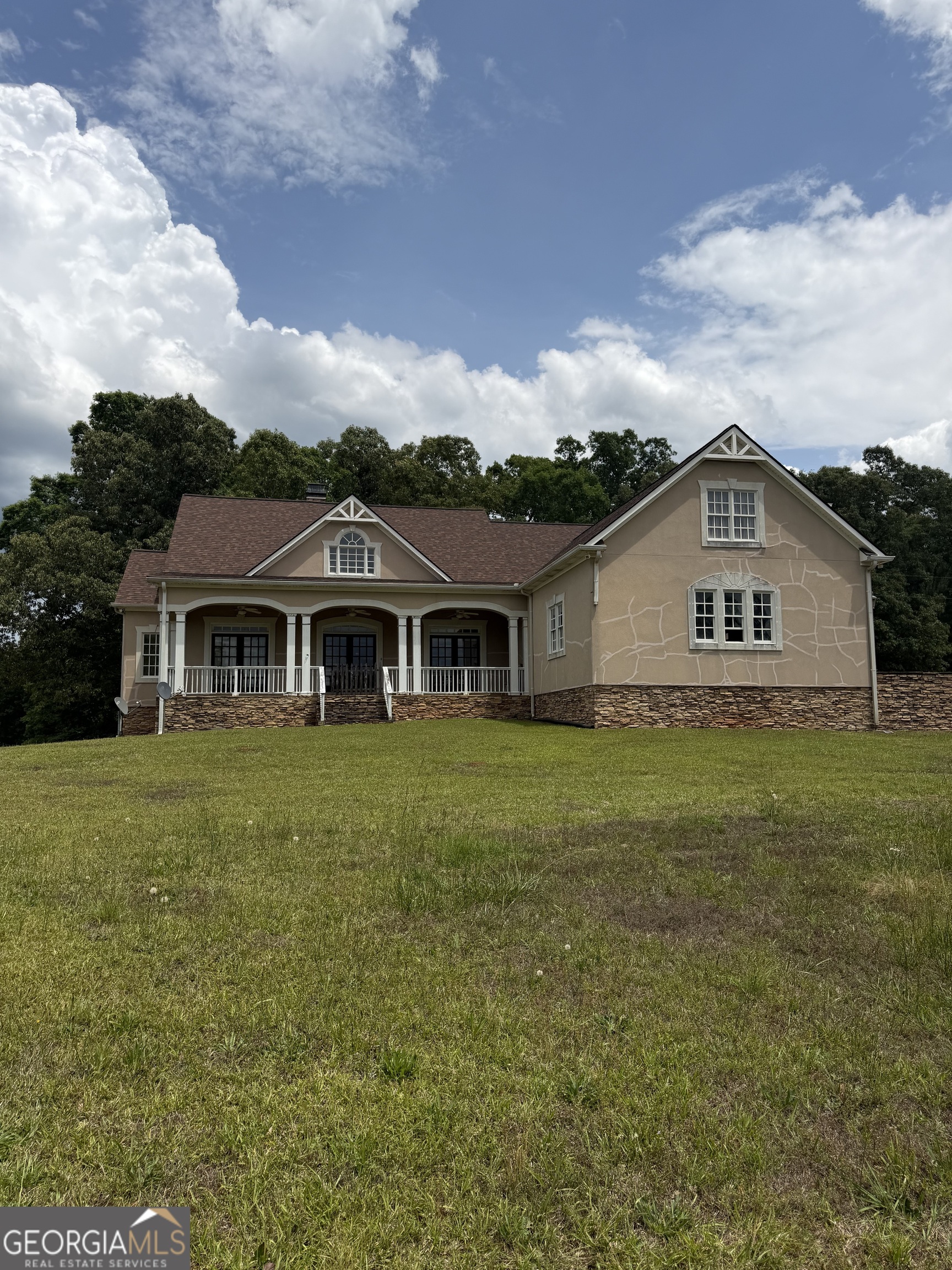 302 Norris Road Barnesville, GA 30204 - Photo 1 of 65 a front view of house with yard and green space