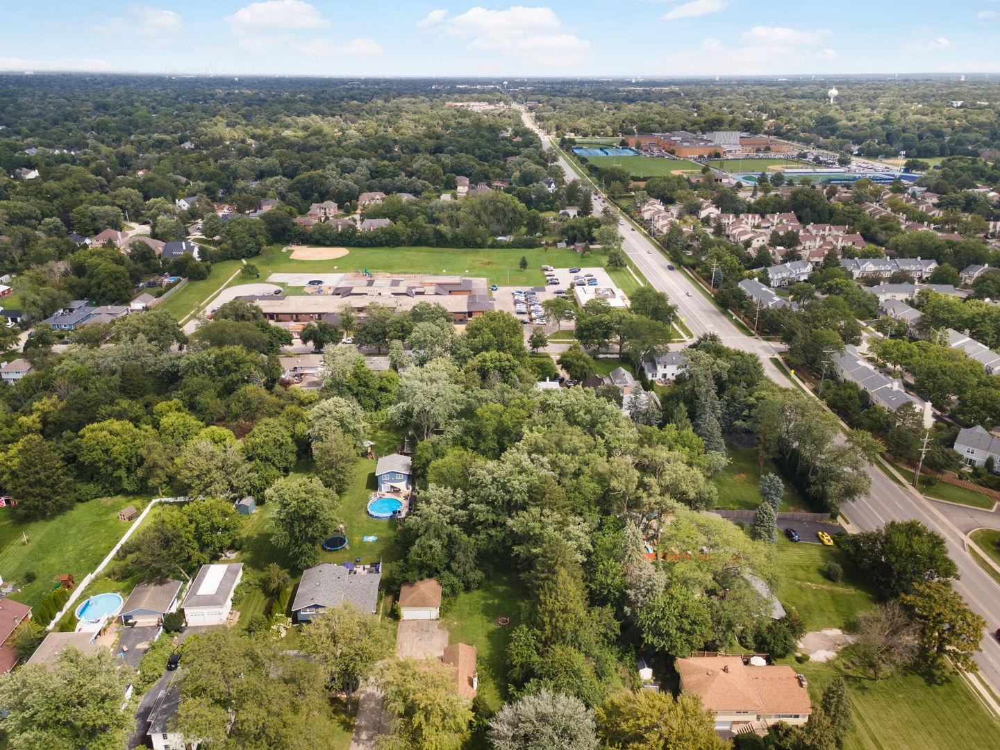 6295 Woodward Avenue Downers Grove, IL 60516 - Photo 3 of 6 an aerial view of residential houses with outdoor space and trees