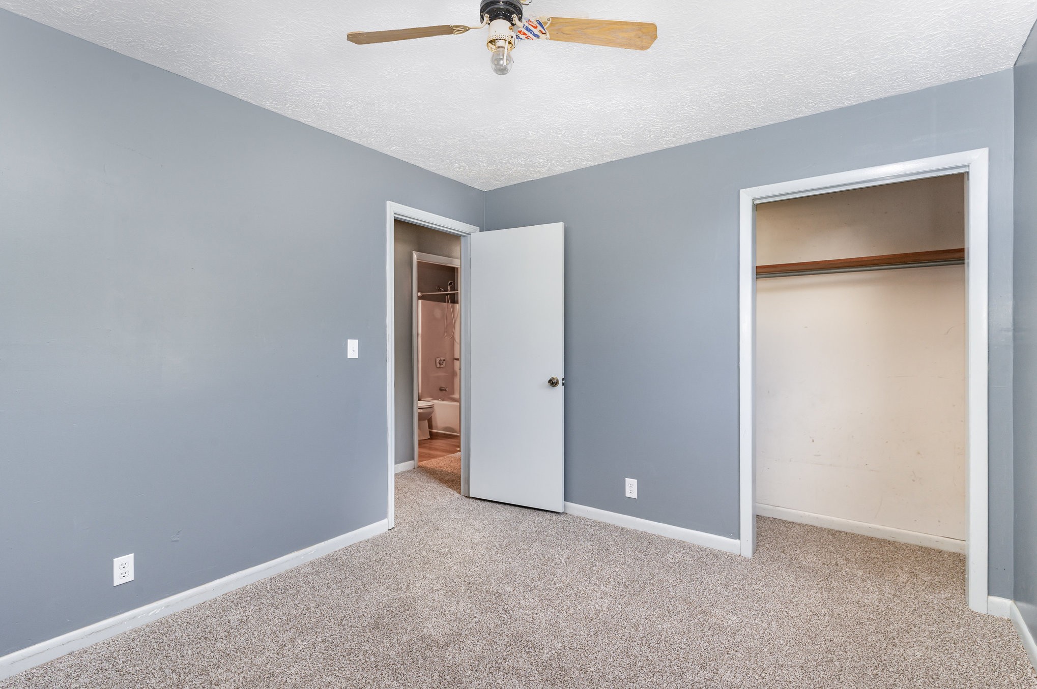 2104 Wolfe Road White Bluff, TN 37187 - Photo 14 of 23 an empty room that has a window and a ceiling fan