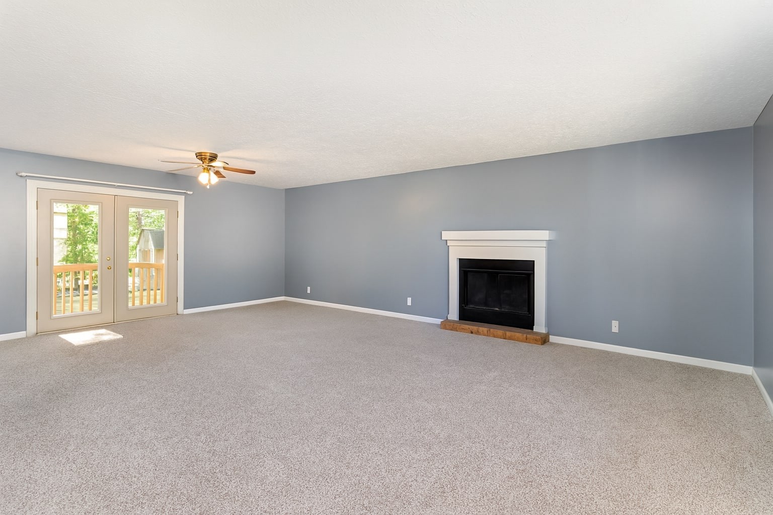 2104 Wolfe Road White Bluff, TN 37187 - Photo 4 of 23 a view of an empty room with a fireplace and a window