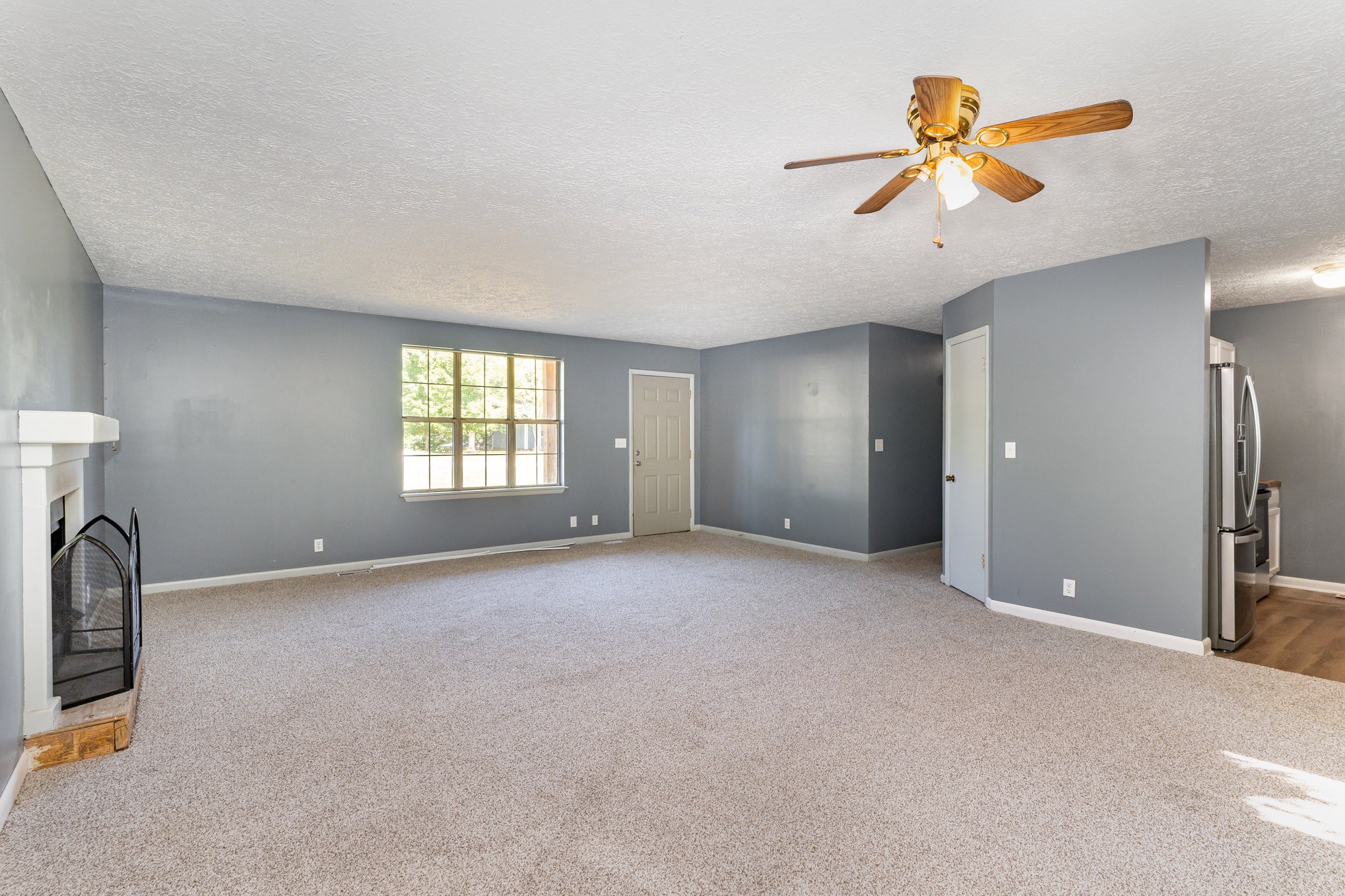 2104 Wolfe Road White Bluff, TN 37187 - Photo 6 of 23 a view of a livingroom with a ceiling fan and window