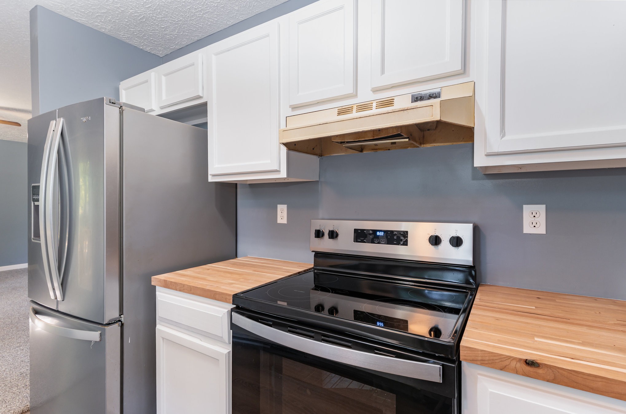 2104 Wolfe Road White Bluff, TN 37187 - Photo 9 of 23 a kitchen with stainless steel appliances granite countertop a refrigerator and a stove top oven