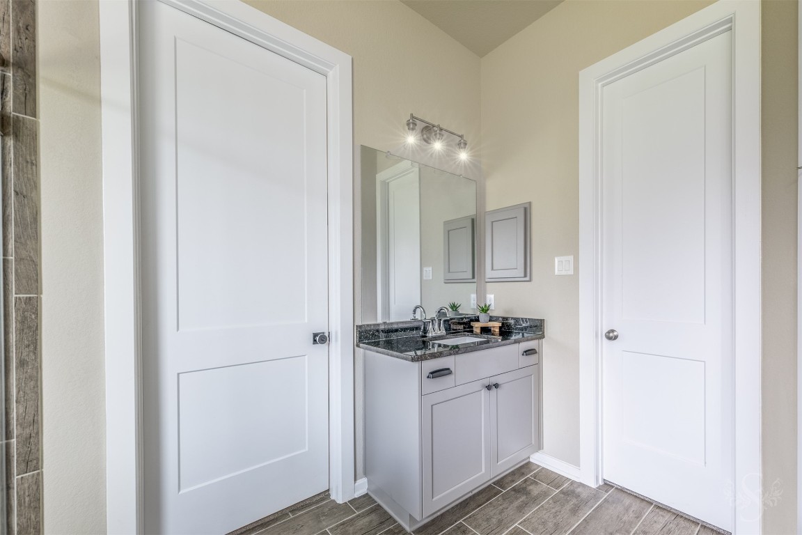 4410 Ana Ridge Lane Fulshear, TX 77441 - Photo 16 of 39 a bathroom with a sink and a mirror