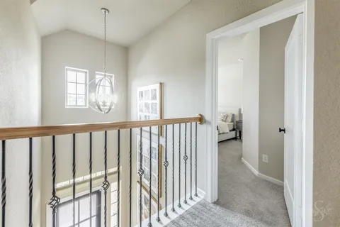 a view of a room with a window and wooden floor