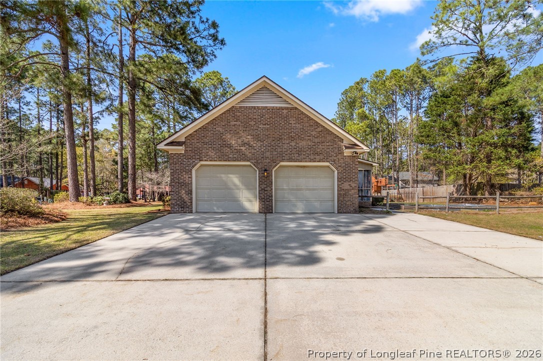 7756 Dragonhead Road Fayetteville, NC 28311 - Photo 4 of 42 a view of a house with a yard and large tree