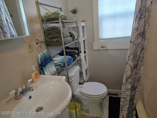 a bathroom with a sink and a toilet