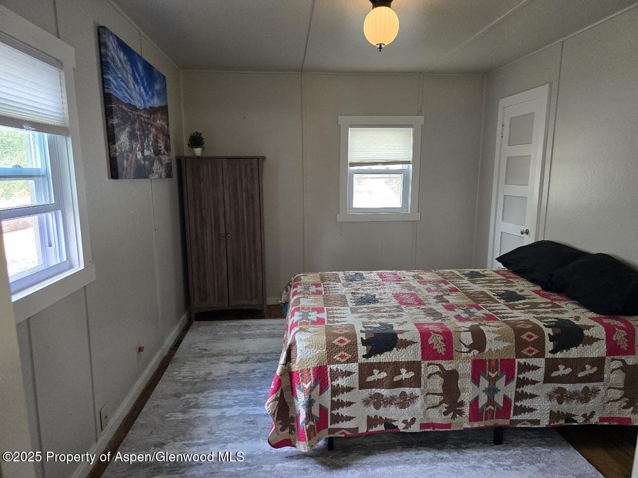 830 Breeze Street Craig, CO 81625 - Photo 16 of 18 a bedroom with a bed and a window