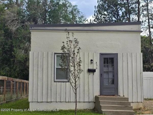a view of a house with a door and a window