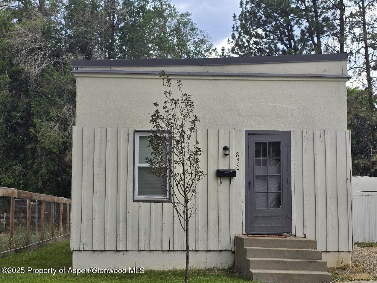 830 Breeze Street Craig, CO 81625 - Photo 2 of 18 a view of a house with a door and a window