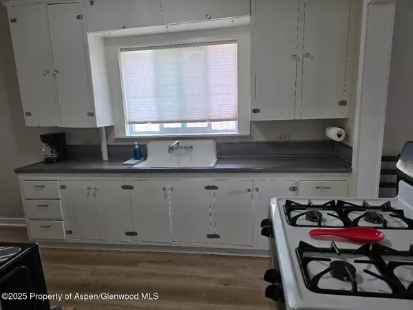 a view of cabinets and window