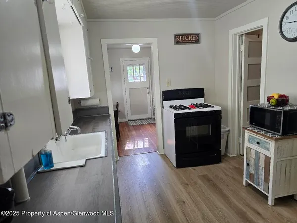 a kitchen with a stove and a refrigerator