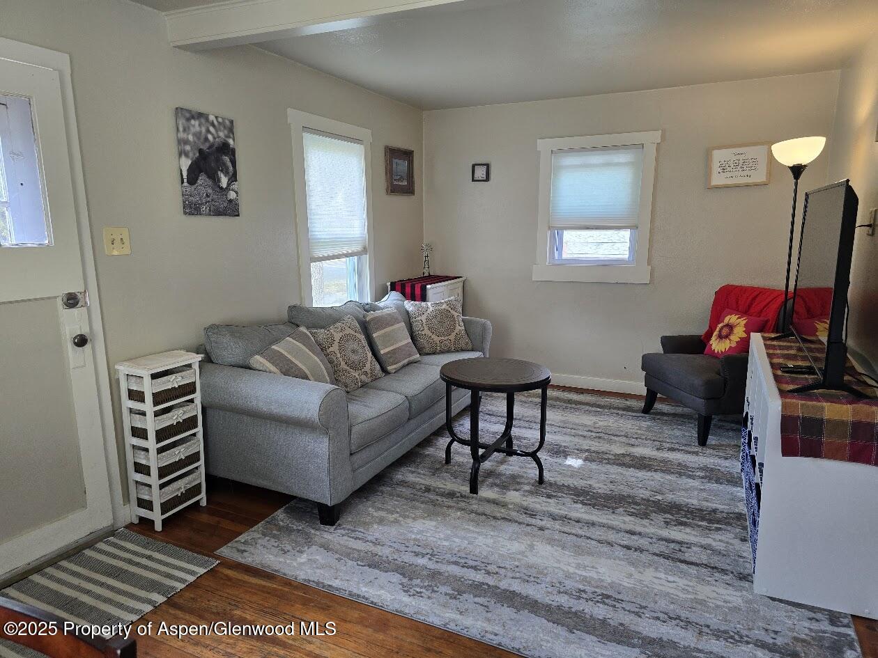 830 Breeze Street Craig, CO 81625 - Photo 7 of 18 a living room with furniture a rug and a window
