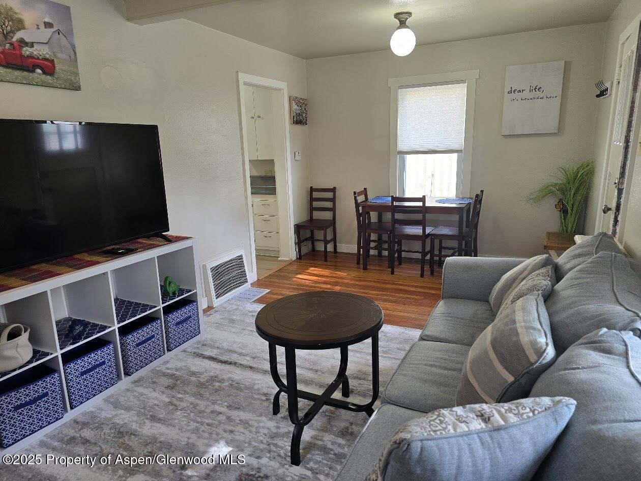 830 Breeze Street Craig, CO 81625 - Photo 9 of 18 a living room with furniture and a flat screen tv