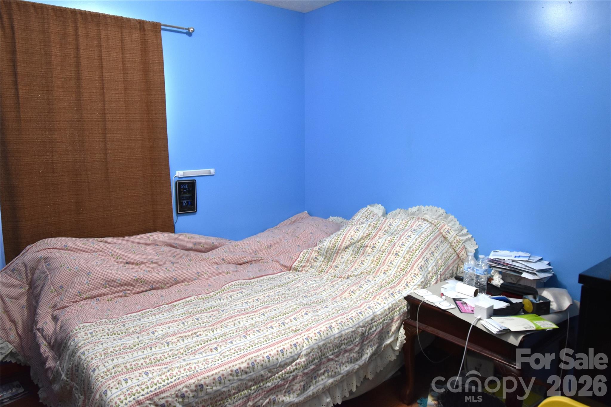 151 Cedar Valley Road Hudson, NC 28638 - Photo 15 of 23 a bedroom with a bed and a table in it