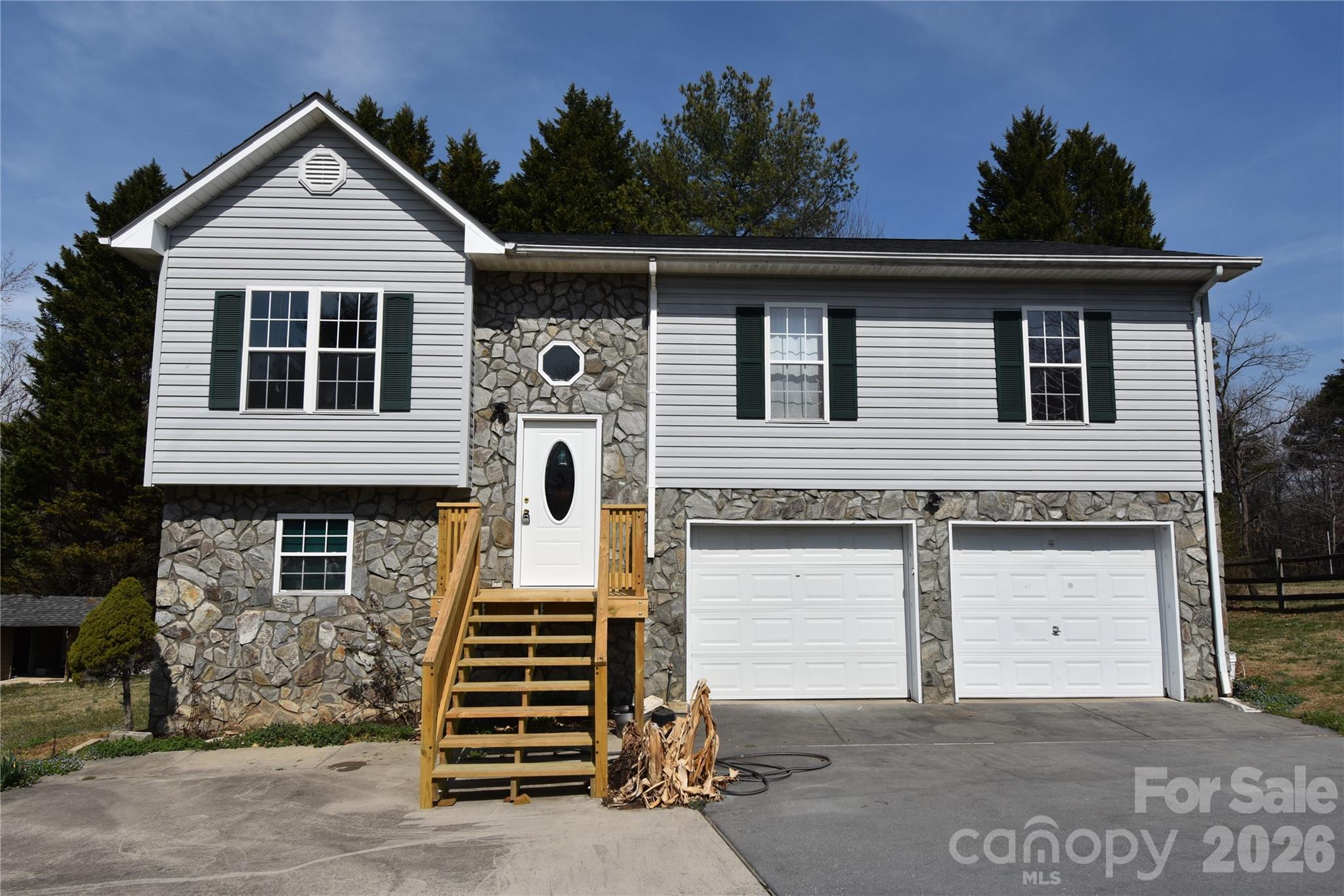 151 Cedar Valley Road Hudson, NC 28638 - Photo 23 of 23 a front view of a house with a garage