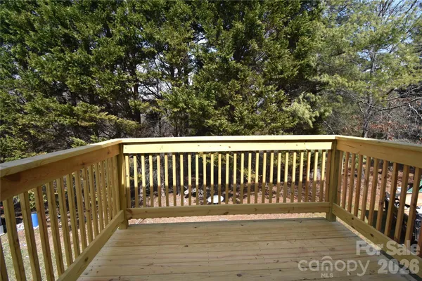 a view of balcony with wooden floor