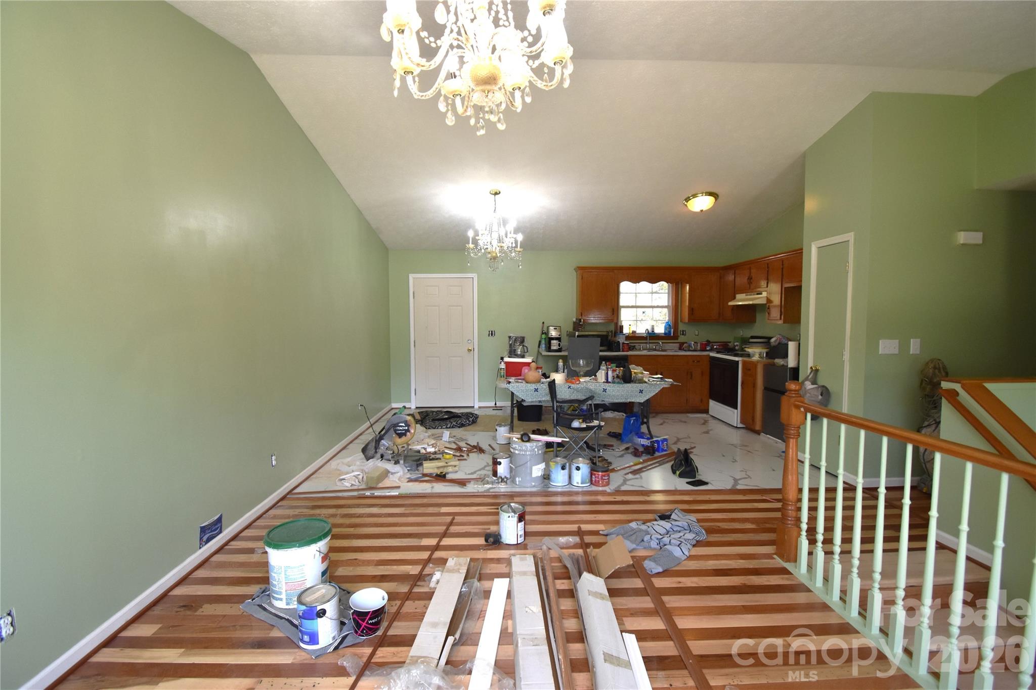 151 Cedar Valley Road Hudson, NC 28638 - Photo 6 of 23 a view of a dining room with furniture a chandelier and wooden floor
