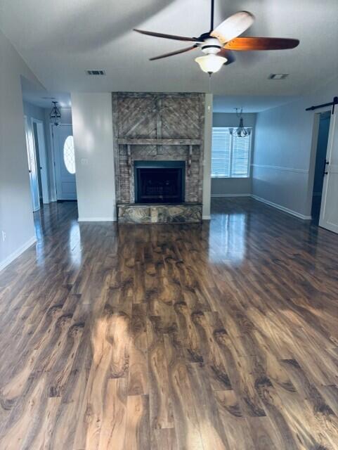 402 Juniper Street Destin, FL 32541 - Photo 2 of 20 a view of empty room with wooden floor and fireplace