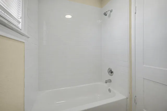 a close up of a bathtub curtain