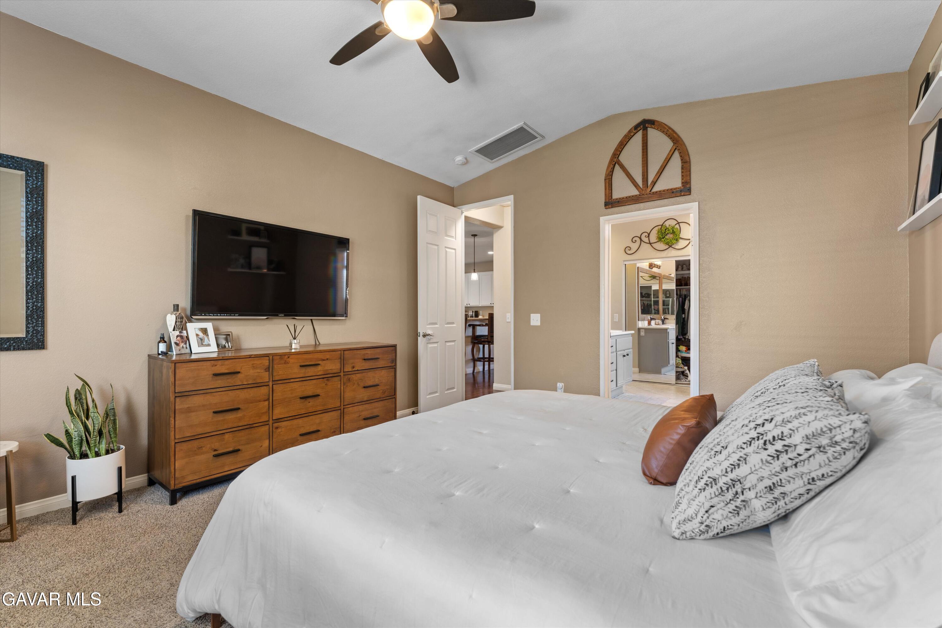 43830 Elena Court Lancaster, CA 93536 - Photo 13 of 22 a bedroom with a bed and a flat screen tv