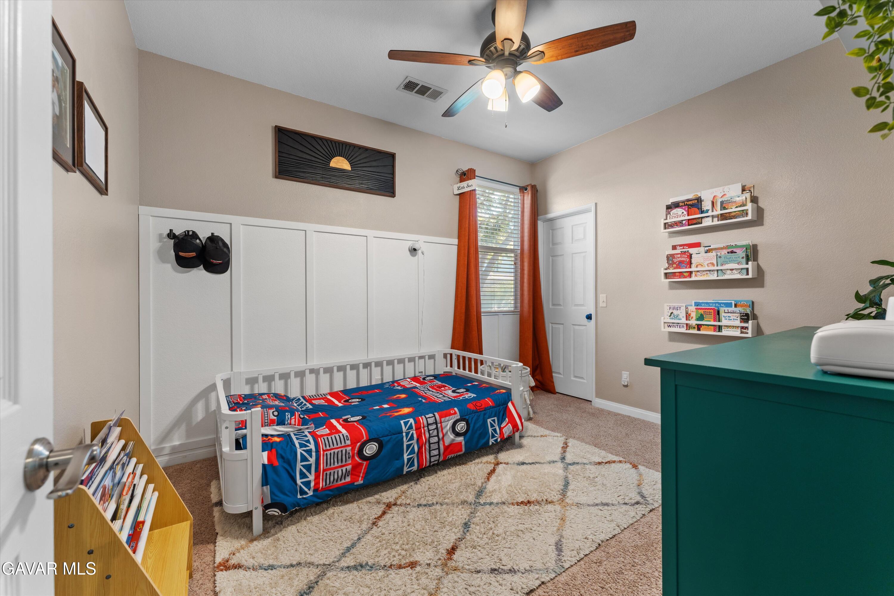 43830 Elena Court Lancaster, CA 93536 - Photo 16 of 22 a bedroom with furniture and a flat screen tv