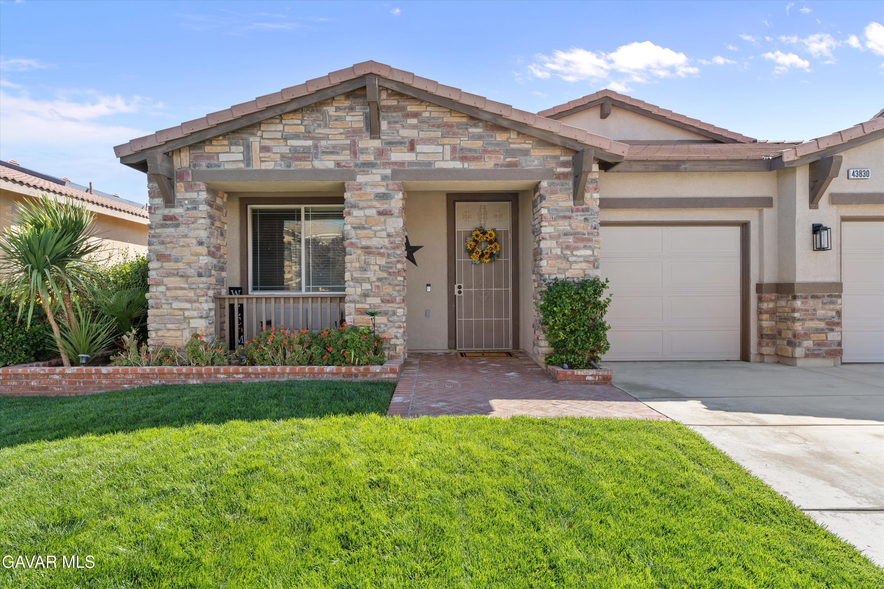 43830 Elena Court Lancaster, CA 93536 - Photo 3 of 22 front view of a house with a yard