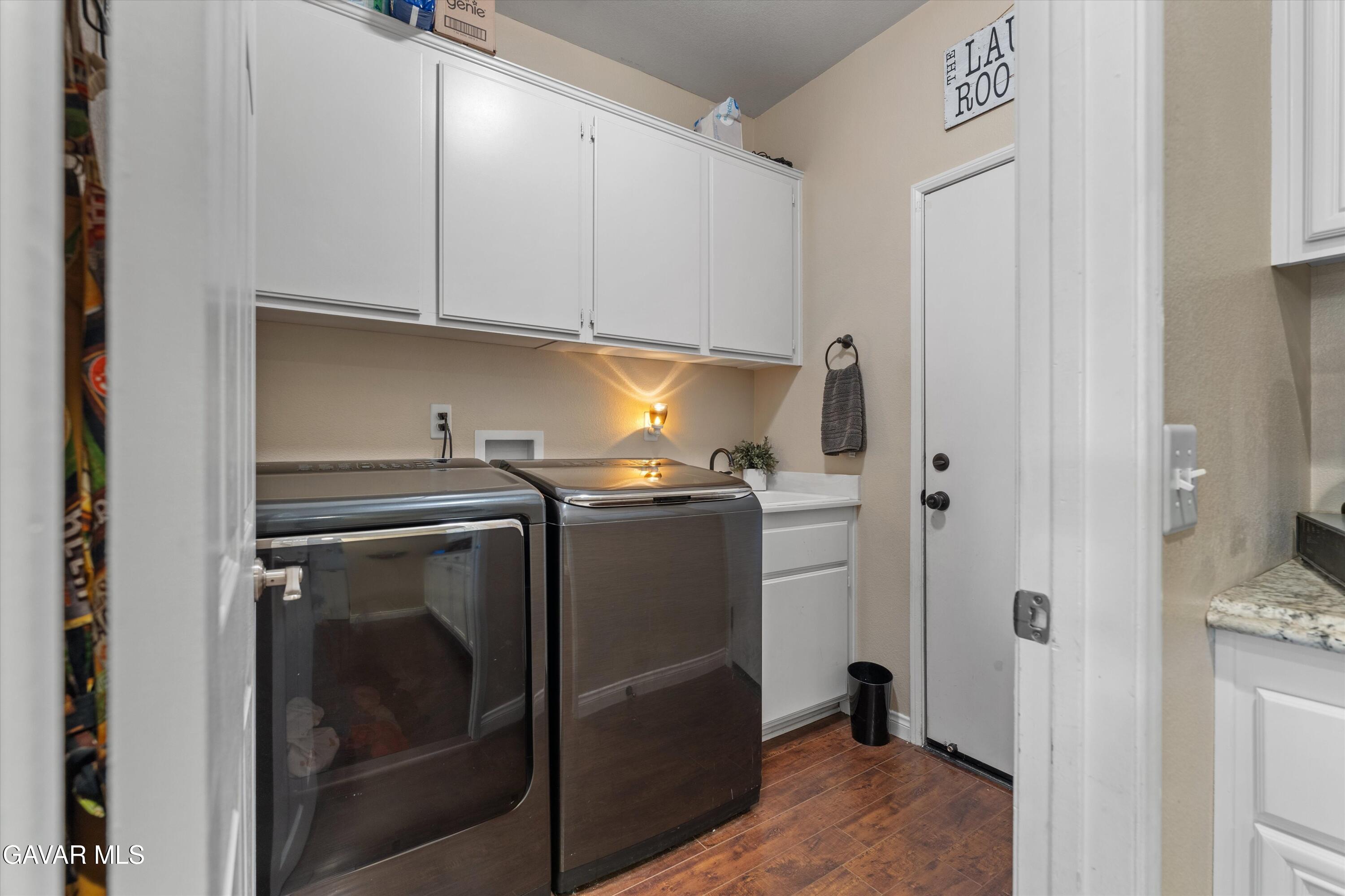 43830 Elena Court Lancaster, CA 93536 - Photo 9 of 22 a utility room with washer and dryer