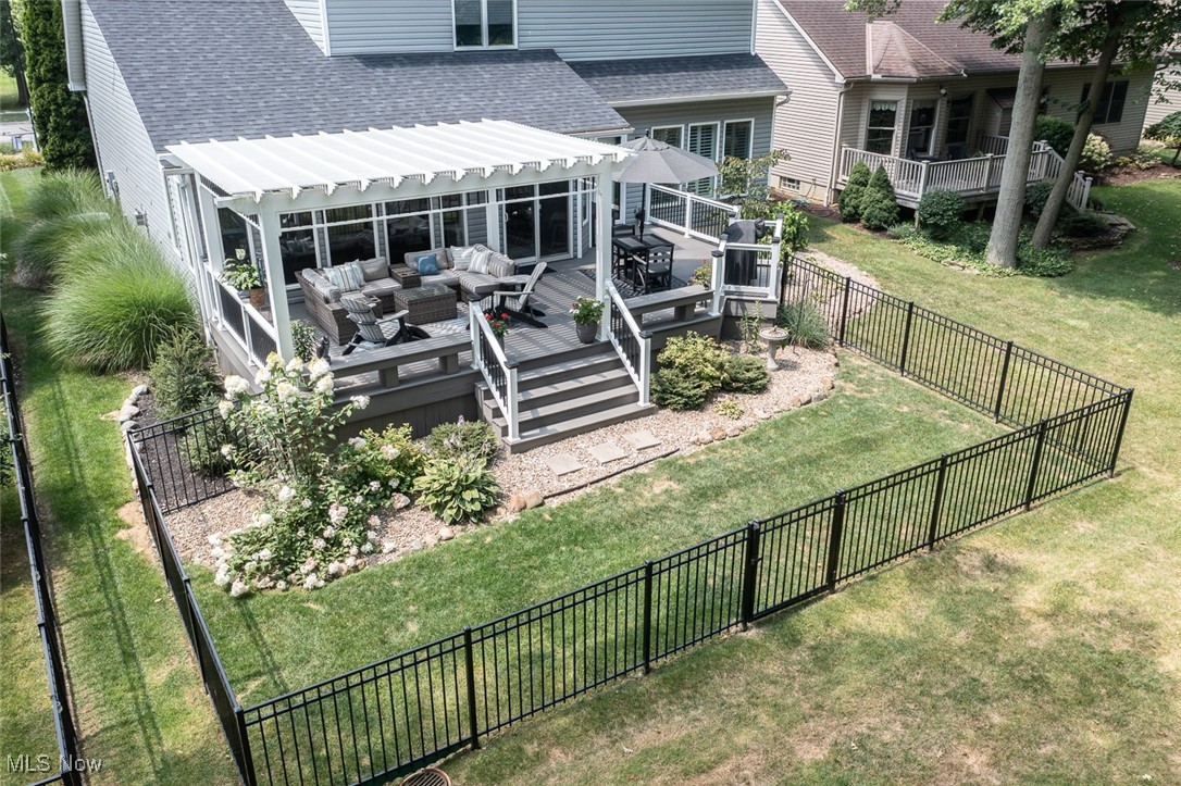 632 Rundle Street Lagrange, OH 44050 - Photo 3 of 30 Back of property featuring outdoor lounge area, a wooden deck, and a shingled roof