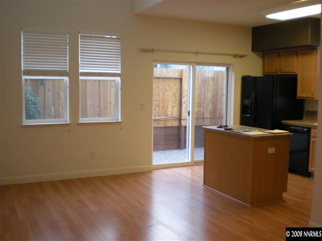 2165 Hellaby Lane Reno, NV 89502 - Photo 3 of 6 a view of a room with wooden floor and windows