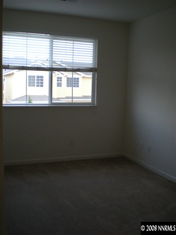 2165 Hellaby Lane Reno, NV 89502 - Photo 4 of 6 a view of an empty room with a window