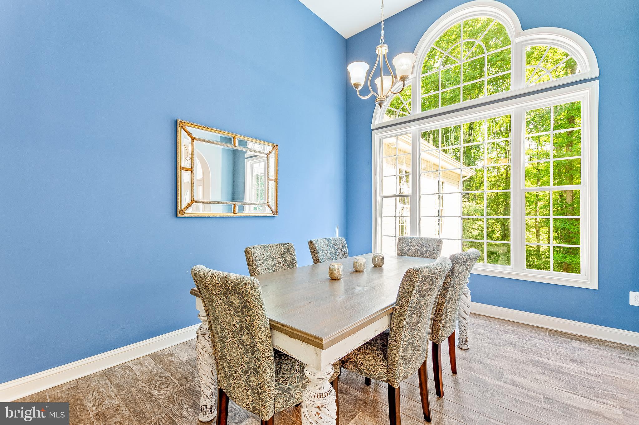 1808 Wilson Road Huntingtown, MD 20639 - Photo 5 of 53 a view of a dining room with furniture a chandelier and wooden floor