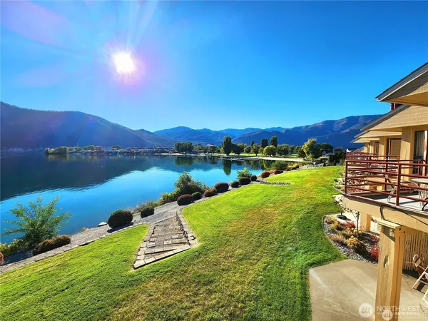 a view of a lake with a yard