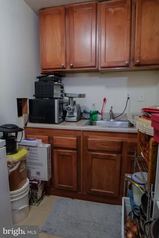 a kitchen with a sink and cabinets