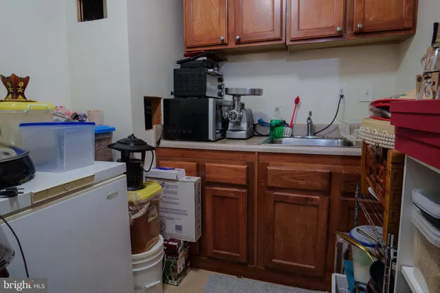 a kitchen with a sink and cabinets