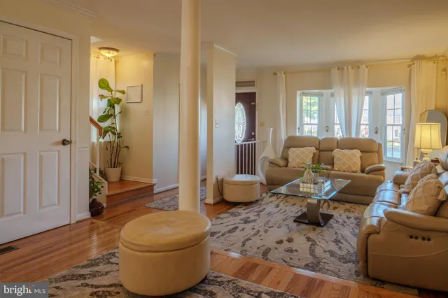 a living room with furniture and a gate