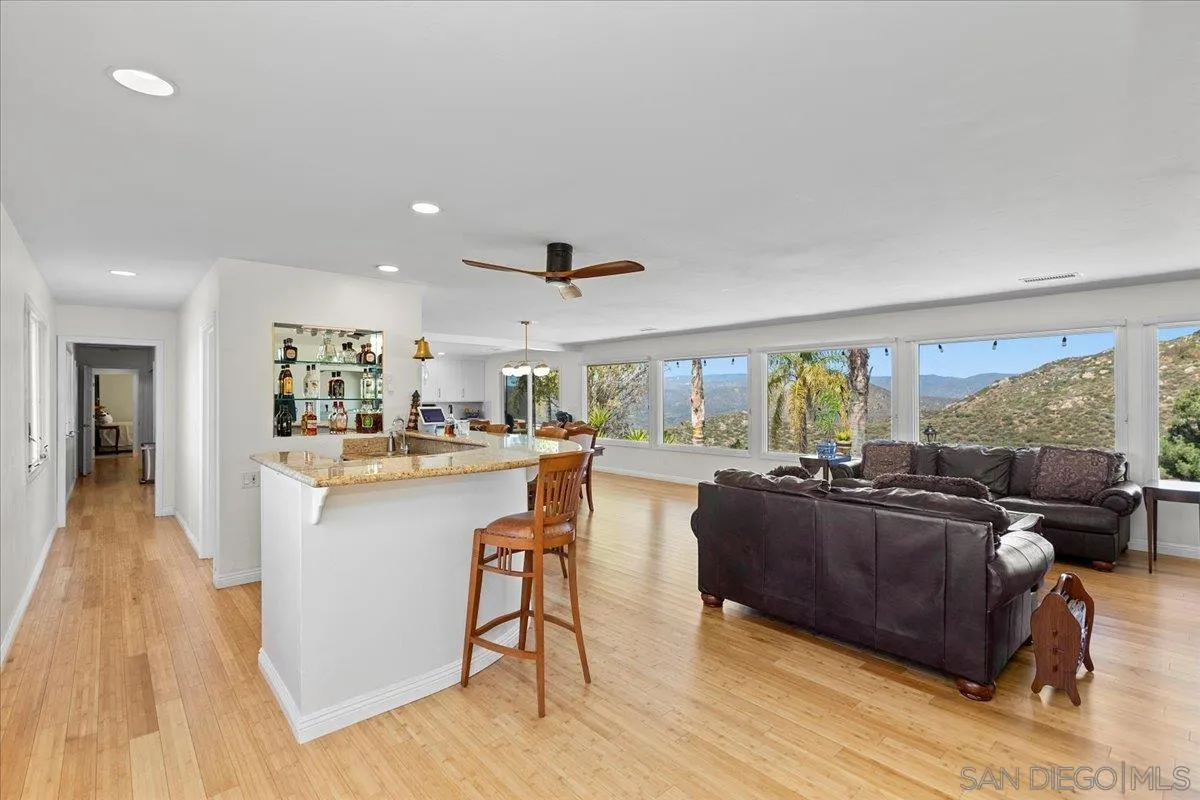 20403 Rancho Villa Road Ramona, CA 92065 - Photo 20 of 66 a living room with furniture and a large window