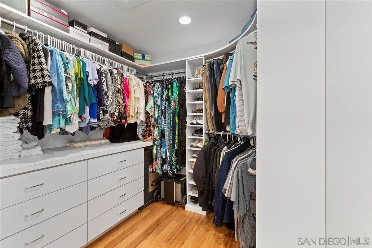 20403 Rancho Villa Road Ramona, CA 92065 - Photo 31 of 66 a view of walk in closet with clothes and shoes