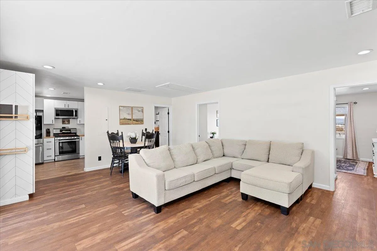 20403 Rancho Villa Road Ramona, CA 92065 - Photo 35 of 66 a living room with furniture and a wooden floor