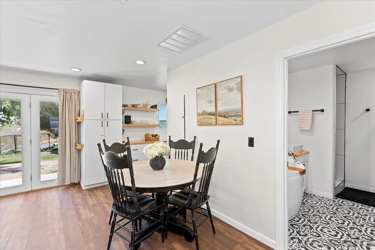 20403 Rancho Villa Road Ramona, CA 92065 - Photo 37 of 66 a view of a dining room with furniture and wooden floor