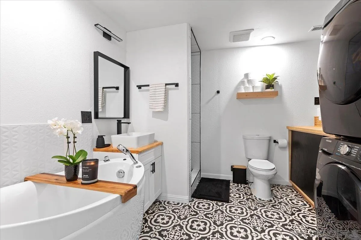 20403 Rancho Villa Road Ramona, CA 92065 - Photo 39 of 66 a bathroom with a sink toilet and a mirror