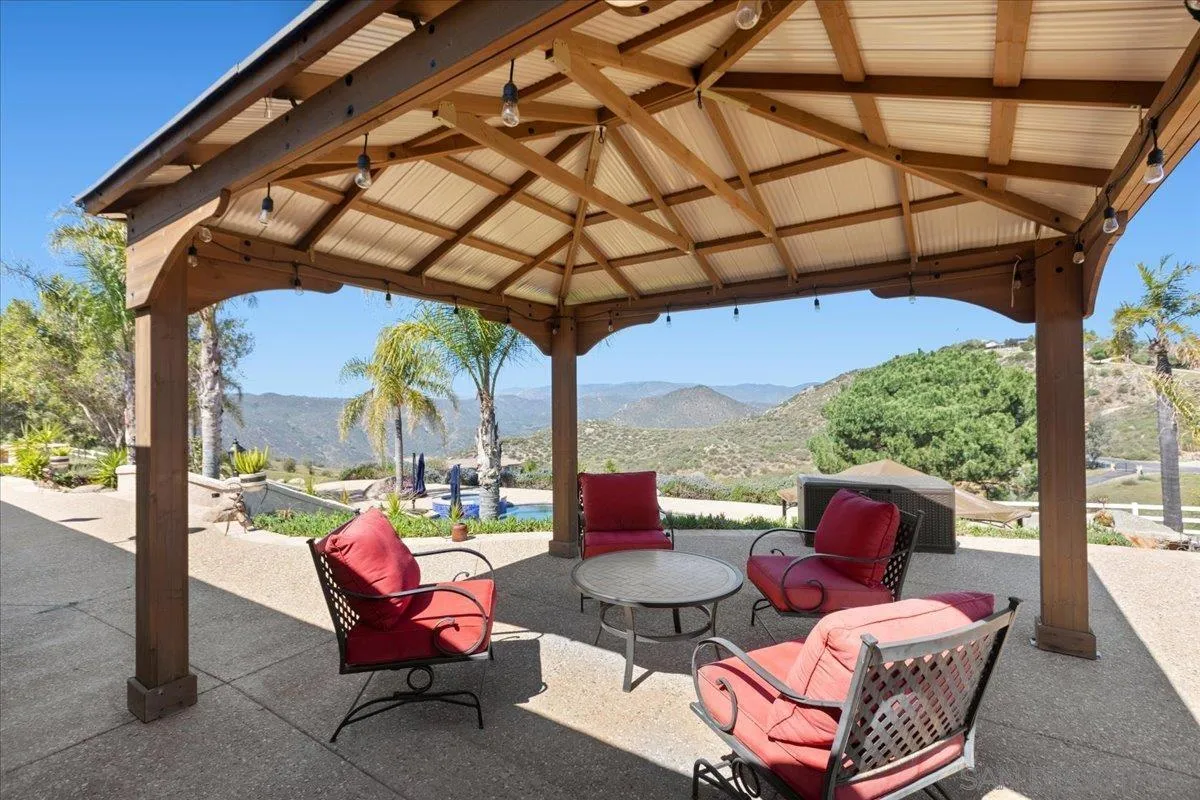 20403 Rancho Villa Road Ramona, CA 92065 - Photo 47 of 66 a view of a patio with couches chairs and a potted plant
