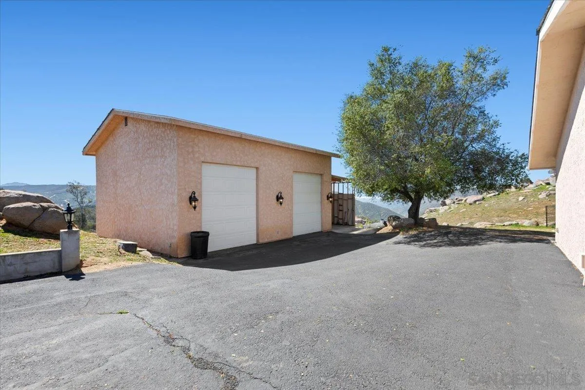 20403 Rancho Villa Road Ramona, CA 92065 - Photo 49 of 66 a view of a house with backyard and parking